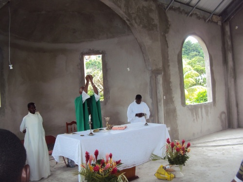 Eucharistic celebration in unfinished chapel in CALIBISHIE